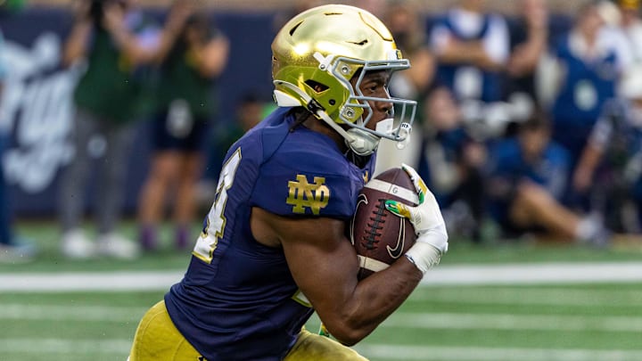 Notre Dame Fighting Irish running back Jadarian Price returns a kick during the second half at Notre Dame Stadium.