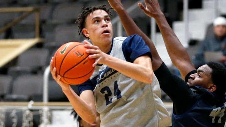 La Lumiere junior Darius Adams looks to put up a shot around teammate Jonas Muya during an open practice Thursday, Nov. 9, 2023, at the La Porte Civic Auditorium. La Lumiere junior Darius Adams looks to put up a shot around teammate Jonas Muya during an open practice Thursday, Nov. 9, 2023, at the La Porte Civic Auditorium.