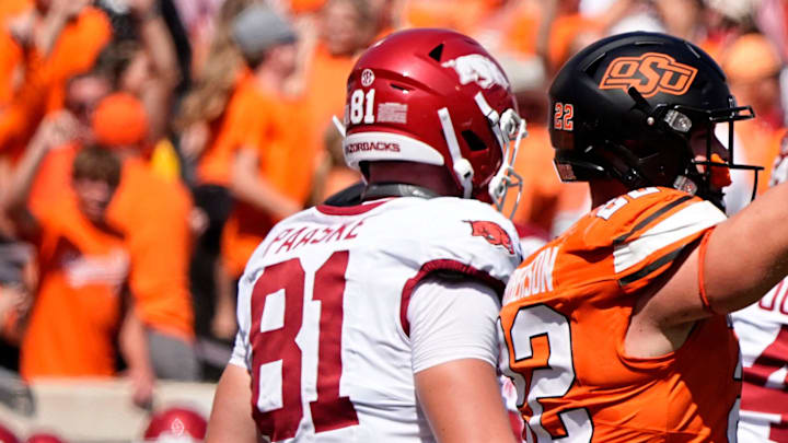 Oklahoma State's Jeff Roberson (22) celebrates the game-winning defensive stop in front of Arkansas' Andreas Paaske (81) and Luke Buchanan (84) in double over time of the college football game between the Oklahoma State Cowboys and the Arkansas Razorbacks at Boone Pickens Stadium in Stillwater, Okla.,, Saturday, Sept., 7, 2024.