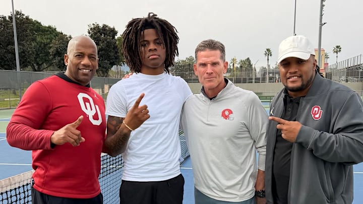 Oklahoma wide receivers coach Emmett Jones, wide receiver target Quentin Hale and head coach Brent Venables.