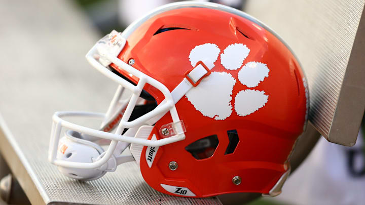 A Clemson Tigers helmet sits on the bench