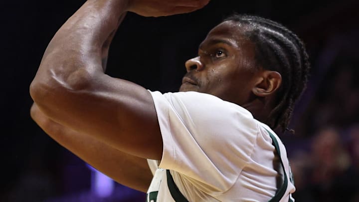 Jan 27, 2026; Piscataway, New Jersey, USA; Michigan State Spartans forward Coen Carr (55) shoots the ball against the Rutgers Scarlet Knights during the first half at Jersey Mike's Arena.