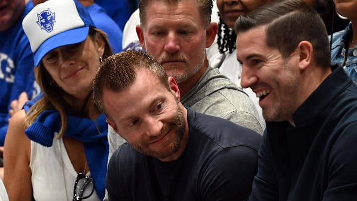 Mar 7, 2026; Durham, North Carolina, USA; Los Angeles Rams head coach Sean McVay (center) looks on from behind the Duke Blue Devils bench prior to a game against the North Carolina Tar Heels at Cameron Indoor Stadium. Mandatory Credit: Rob Kinnan-Imagn Images