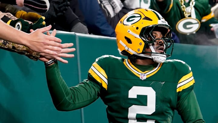 Dec 27, 2025; Green Bay, Wisconsin, USA; Green Bay Packers quarterback Malik Willis (2) high-fives fans after a touchdown during the third quarter against the Baltimore Ravens at Lambeau Field. Mandatory Credit: Kayla Wolf-Imagn Images