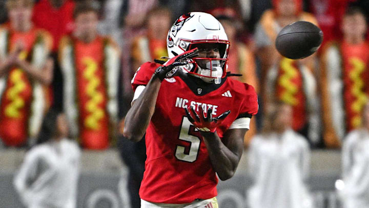 Nov 1, 2025; Raleigh, North Carolina, USA; North Carolina State Wolfpack wide receiver Noah Rogers (5) catches a pass during the second quarter against Georgia Tech Yellow Jackets defensive back Rodney Shelley (6) at Carter-Finley Stadium. Mandatory Credit: Zachary Taft-Imagn Images Nov 1, 2025; Raleigh, North Carolina, USA; North Carolina State Wolfpack wide receiver Noah Rogers (5) catches a pass during the second quarter against Georgia Tech Yellow Jackets defensive back Rodney Shelley (6) at Carter-Finley Stadium. Mandatory Credit: Zachary Taft-Imagn Images