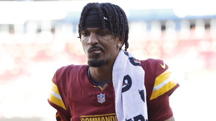 Oct 20, 2024; Landover, Maryland, USA; Washington Commanders quarterback Jayden Daniels (5) walks off the field during the first quarter after an injury against the Carolina Panthers at Northwest Stadium. Mandatory Credit: Amber Searls-Imagn Images Oct 20, 2024; Landover, Maryland, USA; Washington Commanders quarterback Jayden Daniels (5) walks off the field during the first quarter after an injury against the Carolina Panthers at Northwest Stadium. Mandatory Credit: Amber Searls-Imagn Images