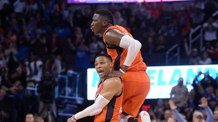 Feb 5, 2017; Oklahoma City, OK, USA; Oklahoma City Thunder guard Russell Westbrook (0) and Oklahoma City Thunder guard Victor Oladipo (5) react after a play against the Portland Trail Blazers during the fourth quarter at Chesapeake Energy Arena. Mandatory Credit: Mark D. Smith-Imagn Images