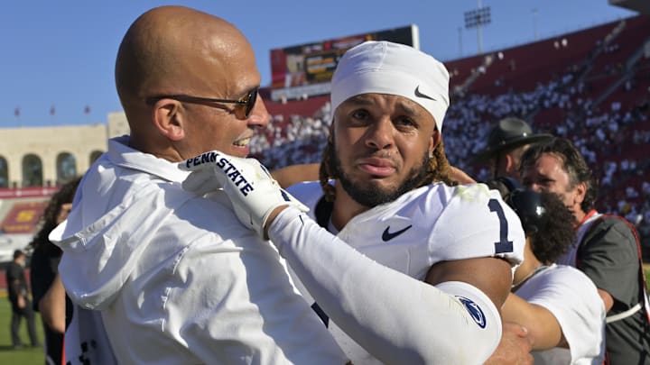 Oct 12, 2024; Los Angeles, California, USA; Penn State Nittany Lions safety Jaylen Reed (1) is congratulated by head coach James Franklin after defeating the USC Trojans in overtime at United Airlines Field at the Los Angeles Memorial Coliseum. Mandatory Credit: Jayne Kamin-Oncea-Imagn Images