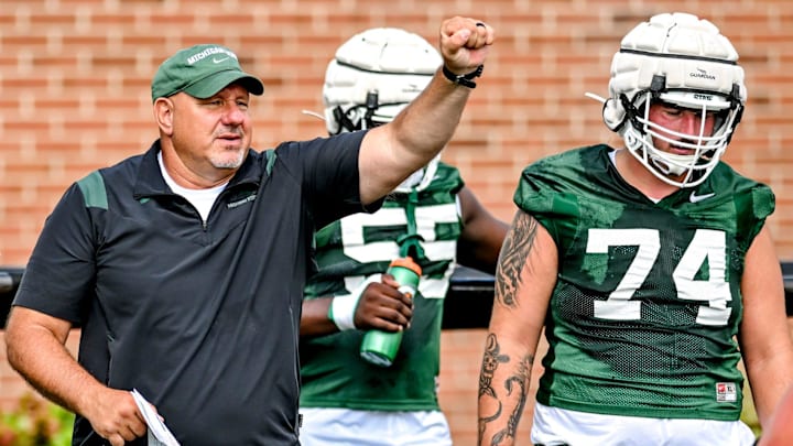 Michigan State's offensive line coach Jim Michalczik works with the team during the first day of football camp on Tuesday, July 30, 2024, in East Lansing.