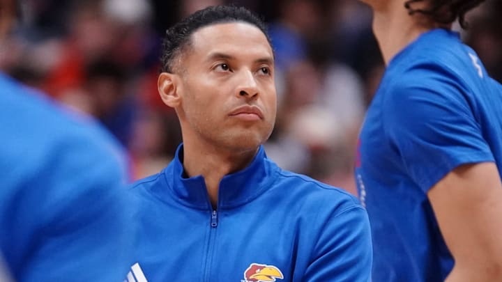 Kansas Jayhawks assistant coach Jeremy Case watches players warm up before taking on Houston Cougars for the game inside Allen Fieldhouse on Monday, Feb. 23, 2026.