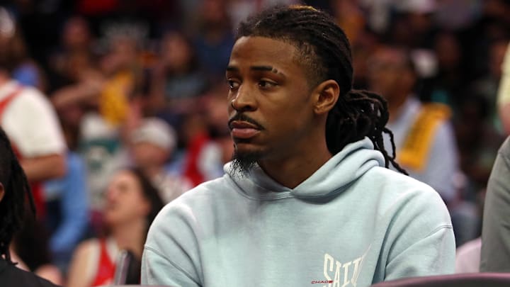 Apr 26, 2025; Memphis, Tennessee, USA; Memphis Grizzlies guard Ja Morant (12) looks on from the bench area during the fourth quarter against the Oklahoma City Thunder during game four for the first round of the 2024 NBA Playoffs at FedExForum. Mandatory Credit: Petre Thomas-Imagn Images