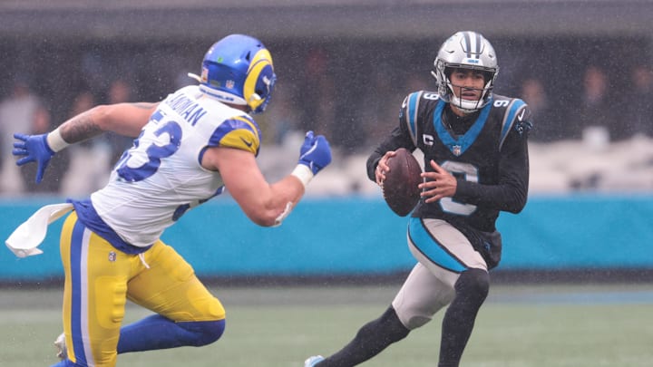 Nov 30, 2025; Charlotte, North Carolina, USA; Carolina Panthers quarterback Bryce Young (9) looks to pass as Los Angeles Rams linebacker Nate Landman (53) defends during the fourth quarter  at Bank of America Stadium. Mandatory Credit: Scott Kinser-Imagn Images