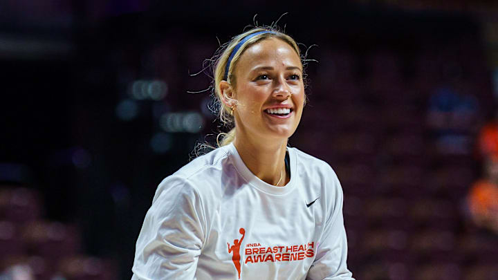 Aug 17, 2025; Uncasville, Connecticut, USA; Indiana Fever guard Sophie Cunningham (8) warms up before the start of the game against the Connecticut Sun at Mohegan Sun Arena. Mandatory Credit: David Butler II-Imagn Images