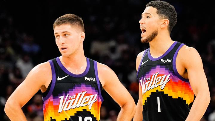 Nov 13, 2025; Phoenix, Arizona, USA; Phoenix Suns guard Collin Gillespie (12) and Phoenix Suns guard Devin Booker (1) during the first half of the game at Mortgage Matchup Center. Mandatory Credit: Arianna Grainey-Imagn Images Nov 13, 2025; Phoenix, Arizona, USA; Phoenix Suns guard Collin Gillespie (12) and Phoenix Suns guard Devin Booker (1) during the first half of the game at Mortgage Matchup Center. Mandatory Credit: Arianna Grainey-Imagn Images