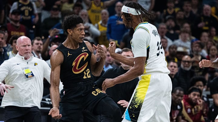 De'Andre Hunter #12 of the Cleveland Cavaliers reacts against Myles Turner #33 of the Indiana Pacers.