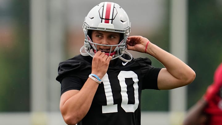 Ohio State Buckeyes quarterback Julian Sayin (10) buckles his helmet during the first football practice of the season at the Woody Hayes Athletic Center on July 31, 2025.