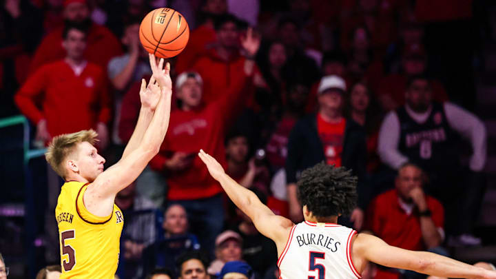 Jan 14, 2026; Tucson, Arizona, USA; Arizona State Sun Devils guard Noah Meeusen (15) makes a three point shot over Arizona Wildcats guard Brayden Burries (5) during the second half of the game at McKale Memorial Center. Mandatory Credit: Aryanna Frank-Imagn Images