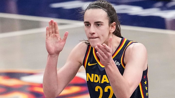 Indiana Fever guard Caitlin Clark (22) claps her hands in excitement Sunday, July 13, 2025, during the game at Gainbridge Fieldhouse in Indianapolis.