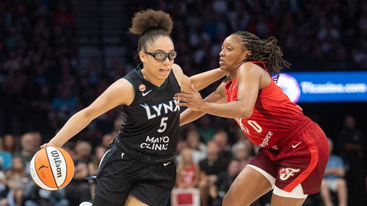 Minnesota Lynx guard Olivia Miles (5) dribbles past the defense of Indiana Fever guard Kelsey Mitchell (0). Minnesota Lynx guard Olivia Miles (5) dribbles past the defense of Indiana Fever guard Kelsey Mitchell (0).