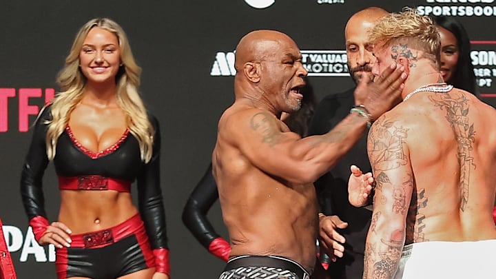 Ring girl Sydney Thomas alongside Mike Tyson and Jake Paul at The Pavilion at Toyota Music Factory for Netflix boxing match
