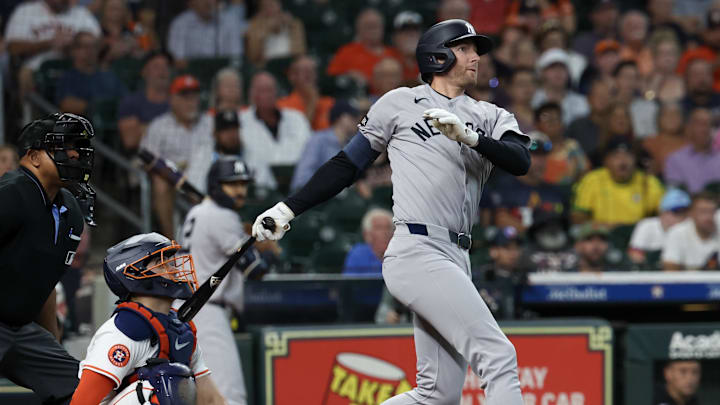 Sep 4, 2025; Houston, Texas, USA; New York Yankees third baseman Ryan McMahon (19) hits an RBI single against the Houston Astros in the second inning at Daikin Park. Mandatory Credit: Thomas Shea-Imagn Images