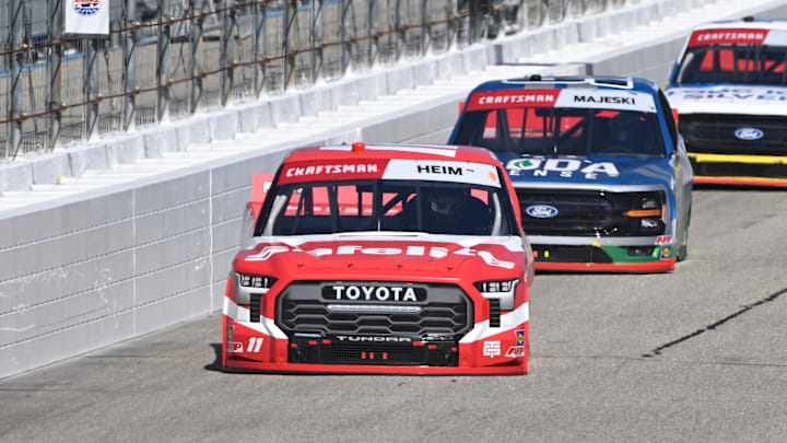 Sep 20, 2025; Loudon, New Hampshire, USA; NASCAR Craftsman Truck Series driver Corey Heim (11) leads a pack of trucks during the Team EJP 175 at New Hampshire Motor Speedway. Sep 20, 2025; Loudon, New Hampshire, USA; NASCAR Craftsman Truck Series driver Corey Heim (11) leads a pack of trucks during the Team EJP 175 at New Hampshire Motor Speedway.