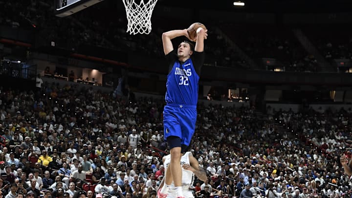 Jul 12, 2025; Las Vegas, NV, USA; Dallas Mavericks forward Cooper Flagg (32) dunks against the San Antonio Spurs in the fourth quarter of their game at Thomas & Mack Center. Mandatory Credit: Candice Ward-Imagn Images