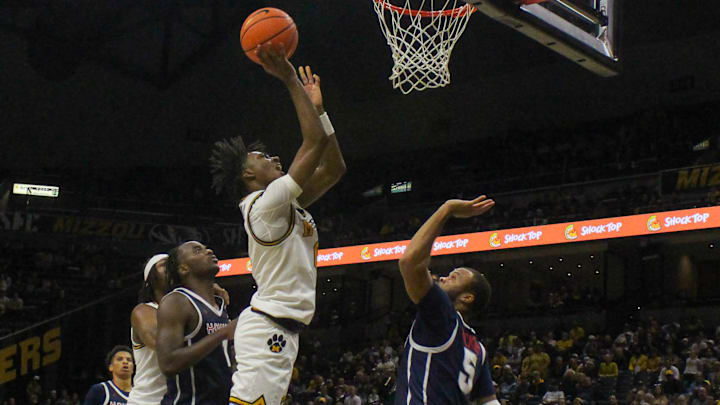 Nov. 8, 2024; Columbia, Missouri, USA; Missouri Tigers guard Anthony Robinson (0) goes for a layup against the Howard Bison.