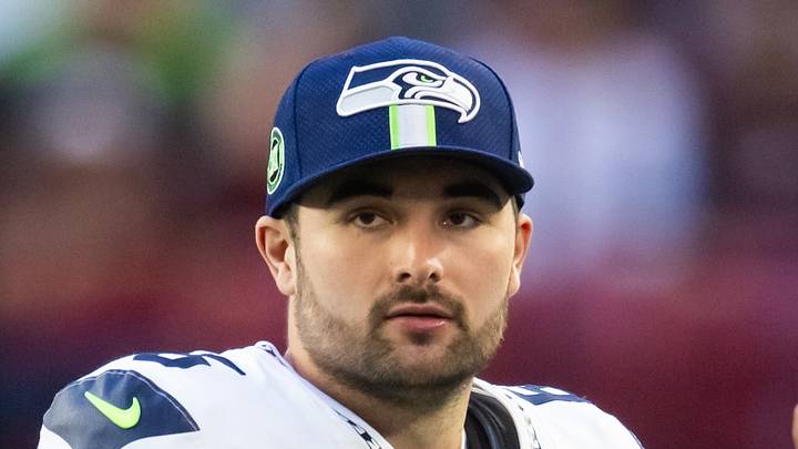Former Seattle Seahawks quarterback Sam Howell stands on the sideline