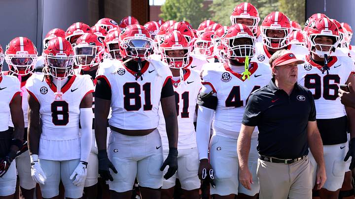 Georgia football coach Kirby Smart leads the team onto the field. Georgia football coach Kirby Smart leads the team onto the field.
