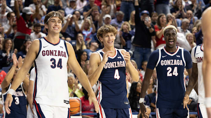 Gonzaga players Braden Huff (34), Davis Fogle (4) and Ismaila Diagne (24).