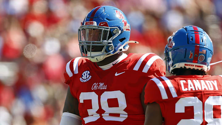 Sep 7, 2024; Oxford, Mississippi, USA; Mississippi Rebels defensive linemen JJ Pegues (38) and defensive back Jadon Canady (28) react after a defensive stop during the first half against the Middle Tennessee Blue Raiders at Vaught-Hemingway Stadium. Mandatory Credit: Petre Thomas-Imagn Images