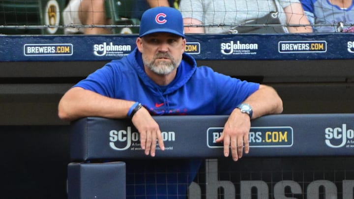 Oct 1, 2023; Milwaukee, Wisconsin, USA; Chicago Cubs manager David Ross looks on from the dugout in the eighth inning during game against the Milwaukee Brewers at American Family Field.