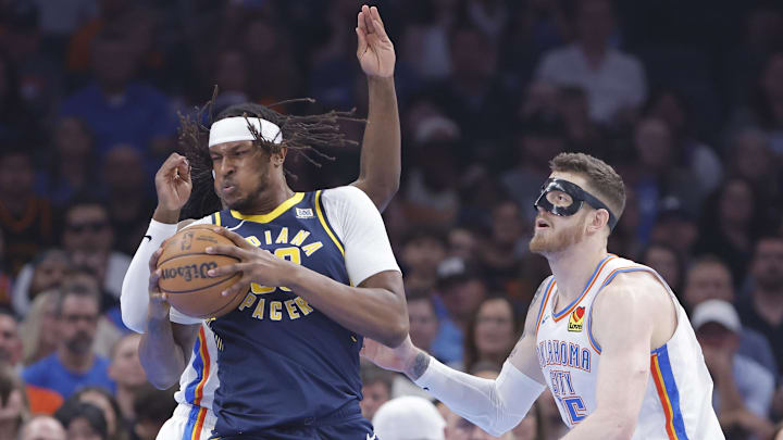 Mar 29, 2025; Oklahoma City, Oklahoma, USA; Indiana Pacers center Myles Turner (33) moves to the basket as Oklahoma City Thunder center Isaiah Hartenstein (55) defends during the first quarter at Paycom Center. Mandatory Credit: Alonzo Adams-Imagn Images Mar 29, 2025; Oklahoma City, Oklahoma, USA; Indiana Pacers center Myles Turner (33) moves to the basket as Oklahoma City Thunder center Isaiah Hartenstein (55) defends during the first quarter at Paycom Center. Mandatory Credit: Alonzo Adams-Imagn Images