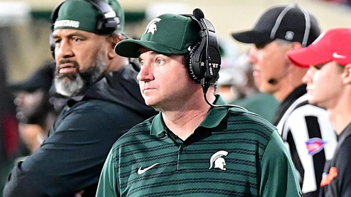 Sep 28, 2024; East Lansing, Michigan, USA; Michigan State Spartans head coach Jonathan Smith watches from the sidelines as the Ohio State Buckeyes defeat his team at Spartan Stadium. Mandatory Credit: Dale Young-Imagn Images