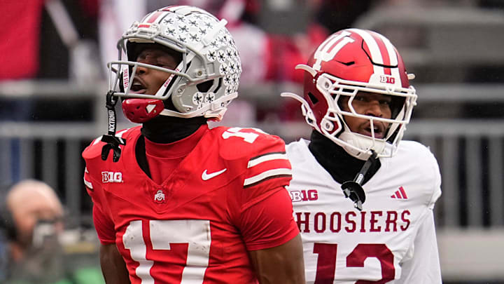 Ohio State Buckeyes wide receiver Carnell Tate (17) celebrates a first down catch in front of Indiana Hoosiers defensive back Terry Jones Jr. (12) during the 2024 season at Ohio Stadium.