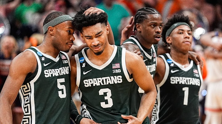 Michigan State guard Jaden Akins (3) is comforted by 
guard Tre Holloman (5) after 70-64 loss to Auburn at the Elite Eight round of NCAA tournament at State Farm Arena in Atlanta, Ga. on Sunday, March 30, 2025.