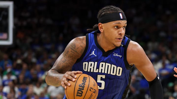 Orlando Magic forward Paolo Banchero is guarded by Boston Celtics guard Derrick White. Orlando Magic forward Paolo Banchero is guarded by Boston Celtics guard Derrick White.