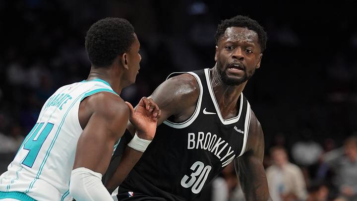 Oct 6, 2026; Charlotte, North Carolina, USA;  Brooklyn Nets forward Julius Randle (30) handles the ball against Charlotte Hornets forward Moussa Diabate (14) during the second quarter at Spectrum Center.  Mandatory Credit: Jim Dedmon-Imagn Images