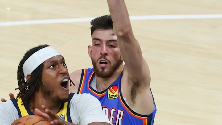 Jun 19, 2025; Indianapolis, Indiana, USA;Indiana Pacers center Myles Turner (33) shoots the ball defended by Oklahoma City Thunder forward Chet Holmgren (7) in the second quarter during game six of the 2025 NBA Finals at Gainbridge Fieldhouse. Mandatory Credit: Trevor Ruszkowski-Imagn Images