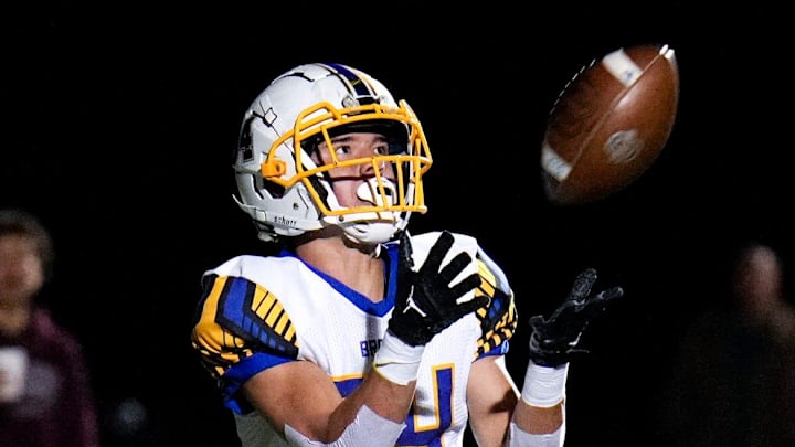 Olentangy   s Kaden Gebhardt (34) catches a touchdown pass while Dublin Jerome   s Patrick Nally (9) defends during a first-round Division I playoff game Oct. 28