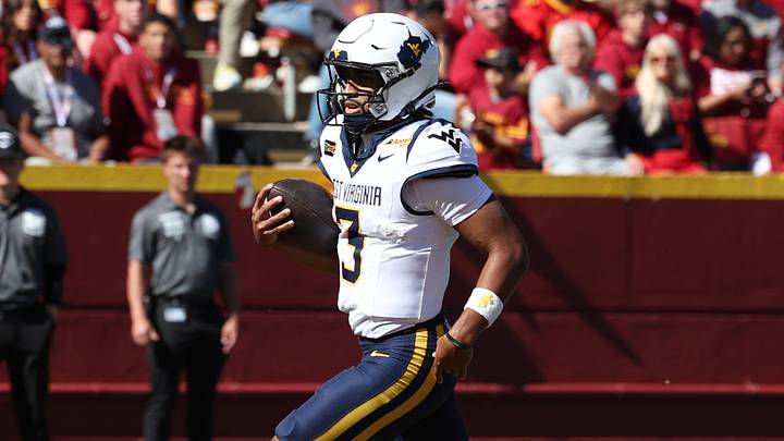 Oct 3, 2026; Ames, Iowa, USA; West Virginia Mountaineers quarterback Michael Hawkins Jr. (3) runs aways from the Iowa State Cyclones defense for a touchdown at Jack Trice Stadium. Mandatory Credit: Reese Strickland-Imagn Images Oct 3, 2026; Ames, Iowa, USA; West Virginia Mountaineers quarterback Michael Hawkins Jr. (3) runs aways from the Iowa State Cyclones defense for a touchdown at Jack Trice Stadium. Mandatory Credit: Reese Strickland-Imagn Images