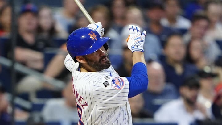 Aug 19, 2024; New York City, New York, USA; New York Mets designated hitter JD Martinez (28) hits a two-run home run against the Baltimore Orioles during the first inning at Citi Field.