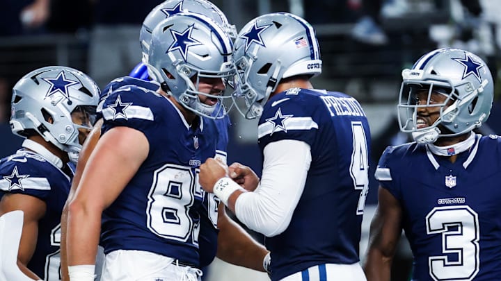 Dallas Cowboys tight end Jake Ferguson celebrates a touchdown with quarterback Dak Prescott 