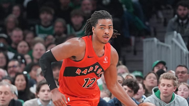 Apr 5, 2026; Boston, Massachusetts, USA; Toronto Raptors forward Collin Murray-Boyles (12) dribbles the ball against the Boston Celtics during the second half at TD Garden. Mandatory Credit: Gregory Fisher-Imagn Images