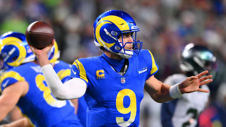 Dec 18, 2025; Seattle, Washington, USA; Los Angeles Rams quarterback Matthew Stafford (9) throws a pass against the Seattle Seahawks in overtime at Lumen Field. Mandatory Credit: Steven Bisig-Imagn Images