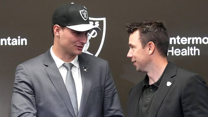 Apr 24, 2026; Henderson, NV, USA; Las Vegas Raiders quarterback Fernando Mendoza (left) shakes hands with head coach Klint Kubiak at introductory press conference at Intermountain Health Performance Center after being selected as the No. 1 pick in the 2026 NFL Draft. Mandatory Credit: Kirby Lee-Imagn Images