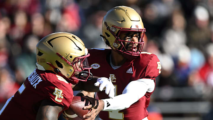 Nov 9, 2024; Chestnut Hill, Massachusetts, USA; Boston College Eagles quarterback Thomas Castellanos (1) hands the ball off to unning back Kye Robichaux (5) during the first half at Alumni Stadium. Mandatory Credit: Brian Fluharty-Imagn Images