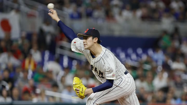 Mar 20, 2023; Miami, Florida, USA; Japan starting pitcher Roki Sasaki (14) delivers a pitch during the first inning against Mexico at LoanDepot Park
