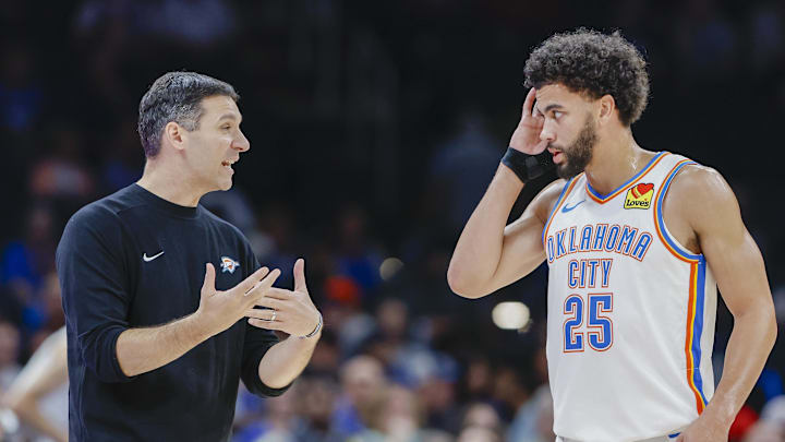 Oct 9, 2024; Oklahoma City, Oklahoma, USA; Oklahoma City Thunder head coach Mark Daigneault talks to guard Ajay Mitchell (25) during a break in play in the second half at Paycom Center. Mandatory Credit: Alonzo Adams-Imagn Images
